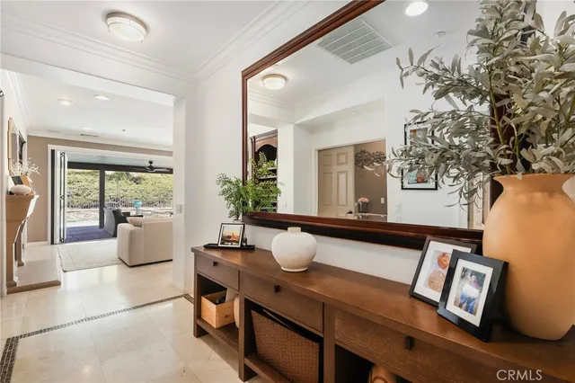 a bedroom with furniture and a large window