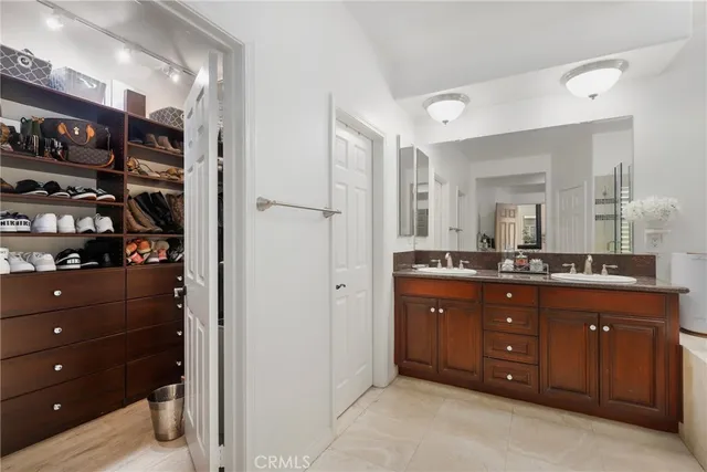 a living room with patio furniture and a floor to ceiling window