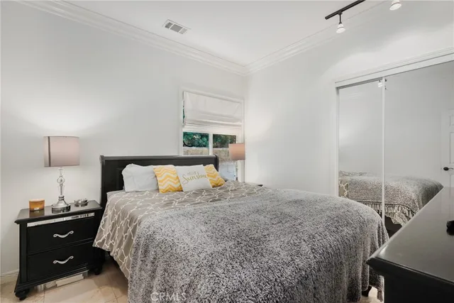 a view of a patio with table and chairs and potted plants
