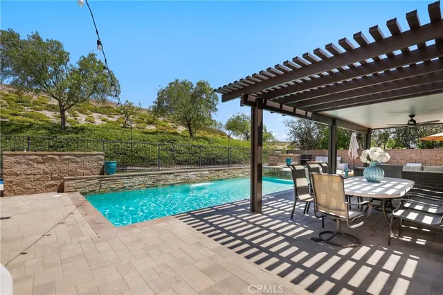 a view of a swimming pool with a patio