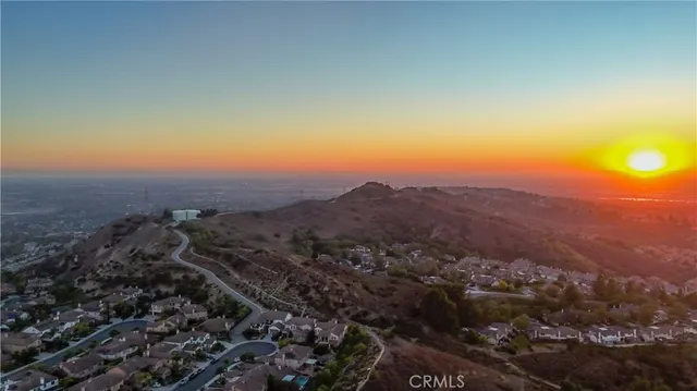 a living room with furniture and a view of kitchen