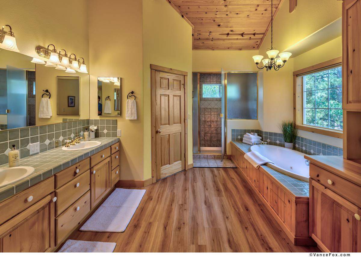 378 Skidder Trail Truckee, CA 96161 - Photo 13 of 21 a spacious bathroom with a granite countertop sink mirror and a shower