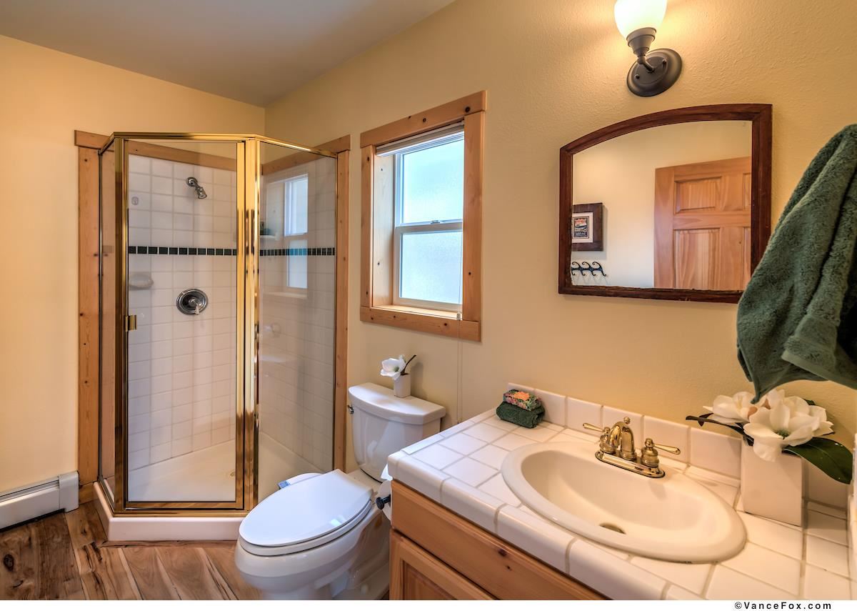 378 Skidder Trail Truckee, CA 96161 - Photo 15 of 21 a bathroom with a sink toilet and shower