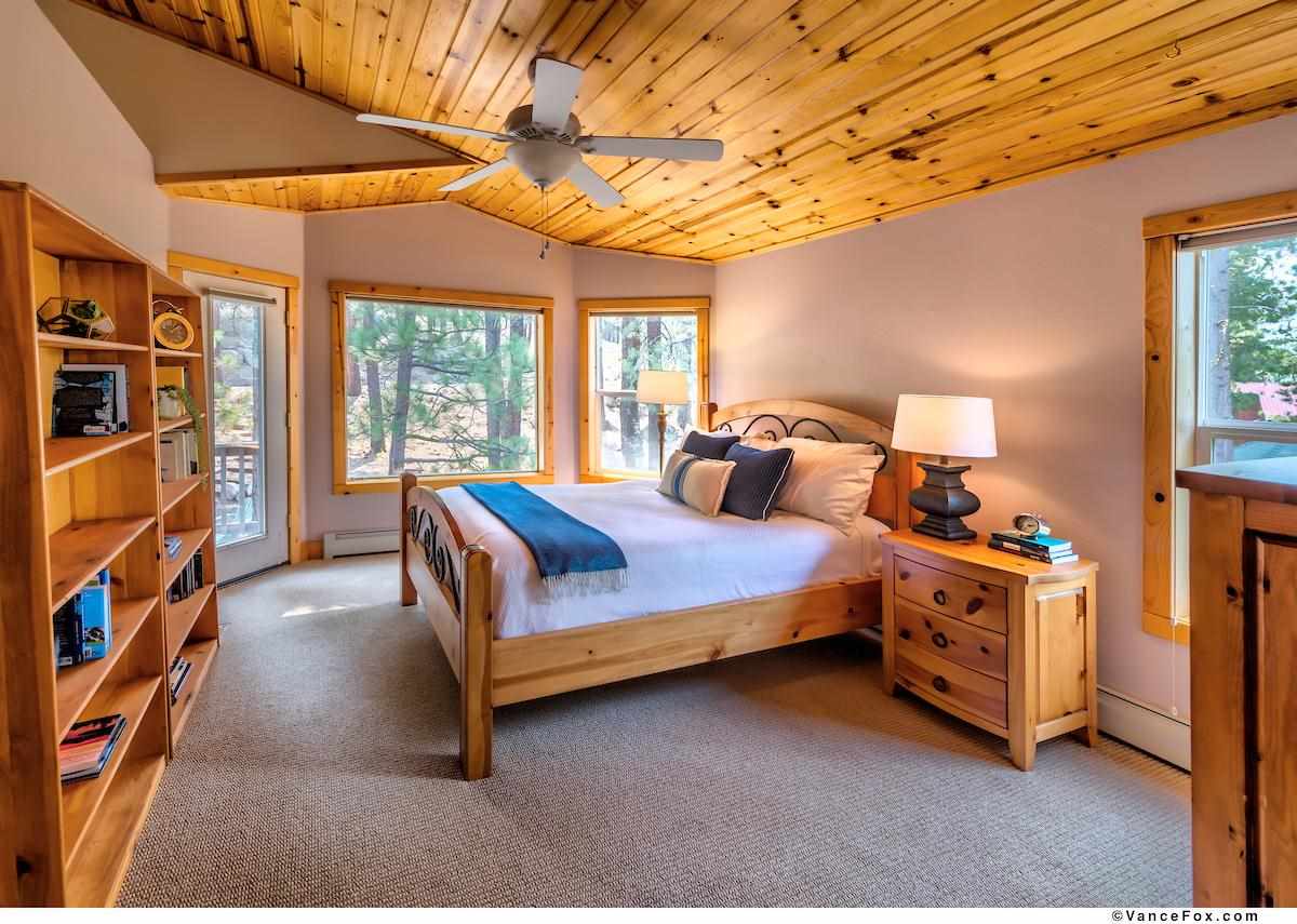 378 Skidder Trail Truckee, CA 96161 - Photo 16 of 21 a bed room with a bed and a book shelf