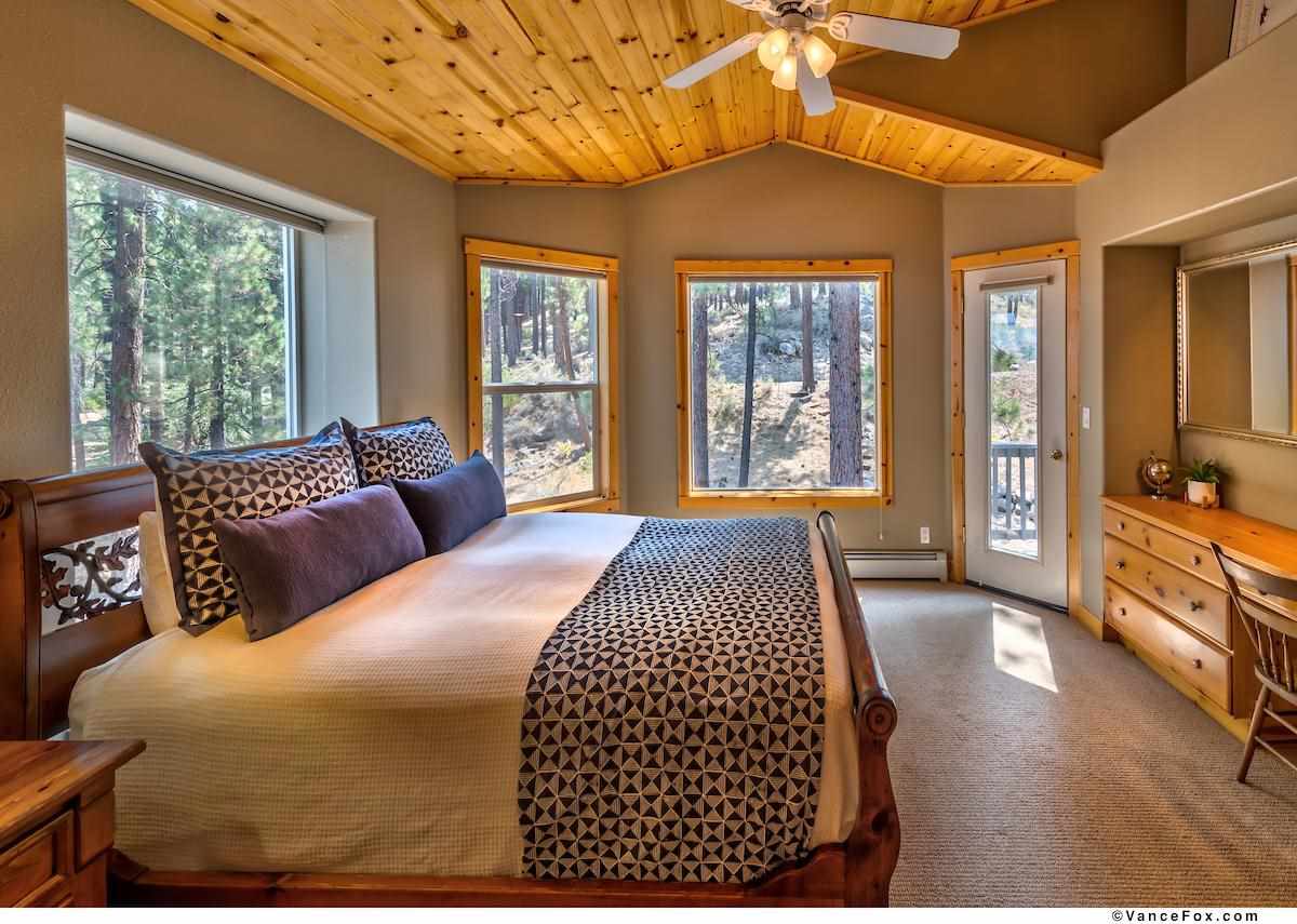 378 Skidder Trail Truckee, CA 96161 - Photo 17 of 21 a bedroom with a large bed and a balcony