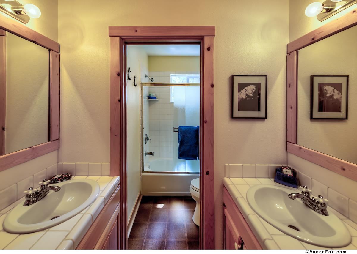 378 Skidder Trail Truckee, CA 96161 - Photo 18 of 21 a bathroom with a tub sink and mirror