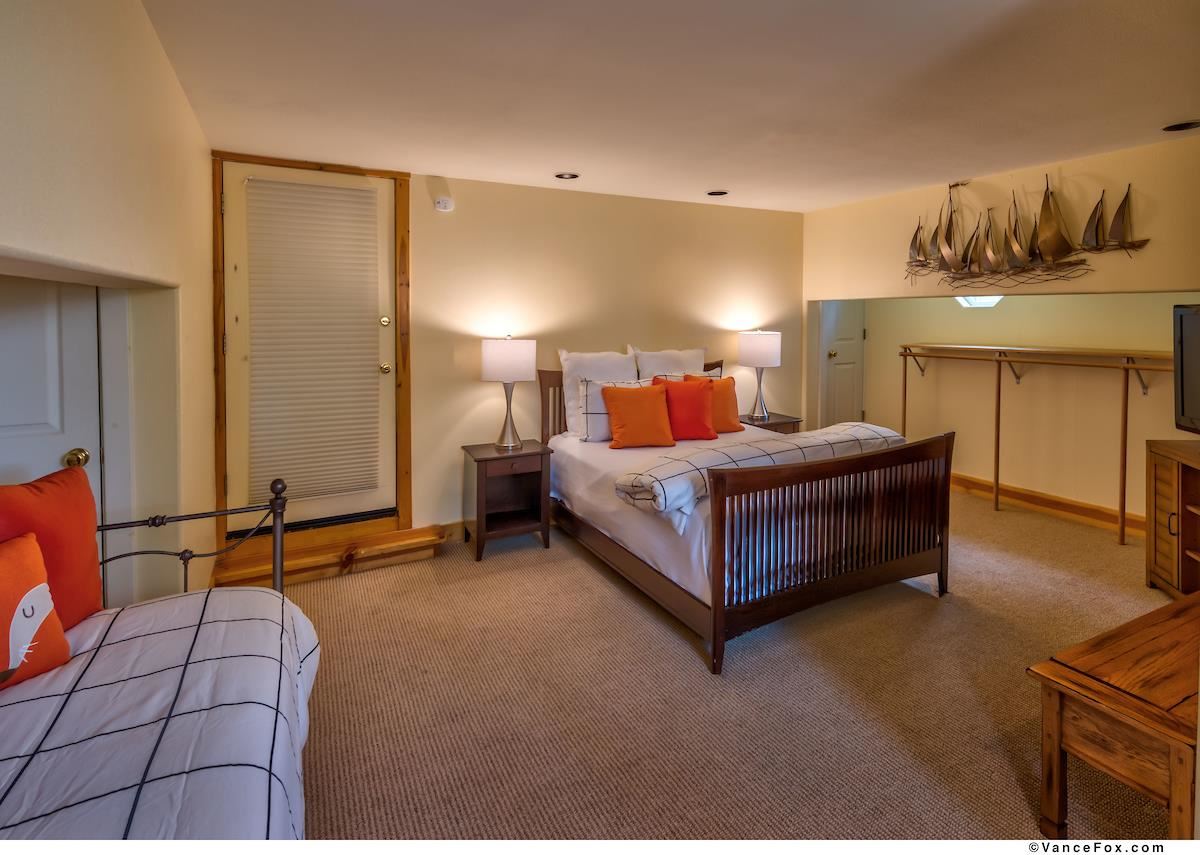 378 Skidder Trail Truckee, CA 96161 - Photo 19 of 21 a bedroom with a bed and lamp