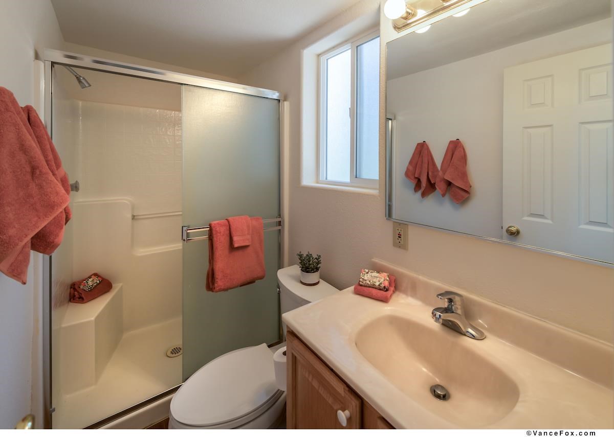378 Skidder Trail Truckee, CA 96161 - Photo 20 of 21 a bathroom with a sink vanity mirror and toilet