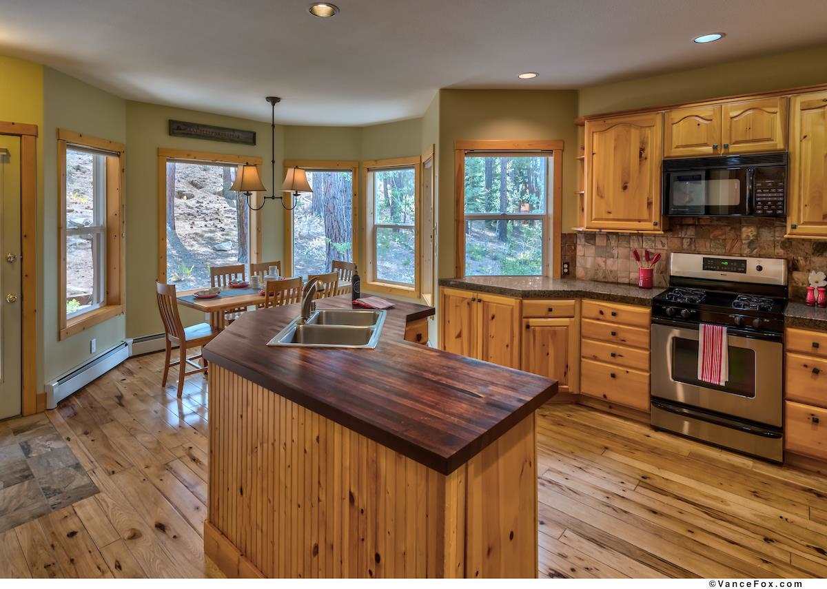 378 Skidder Trail Truckee, CA 96161 - Photo 5 of 21 a kitchen with a stove a sink and a microwave