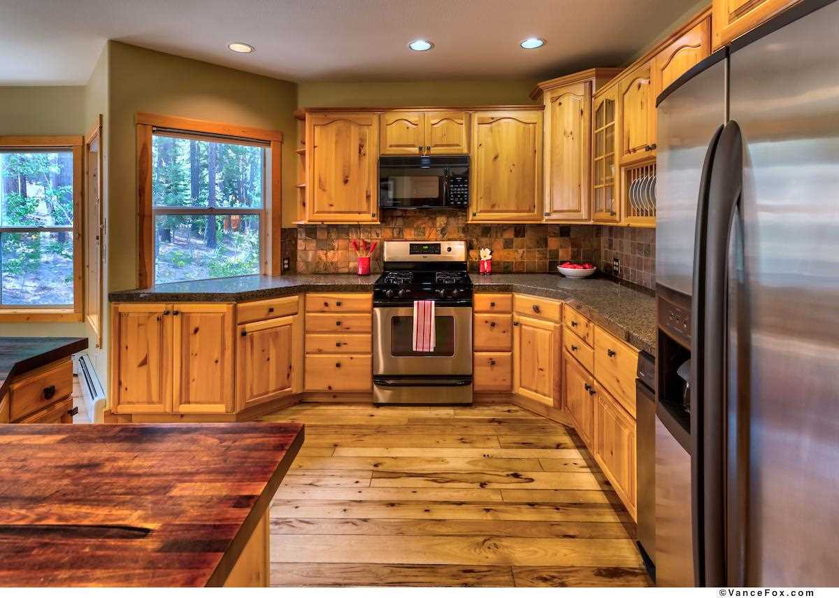 378 Skidder Trail Truckee, CA 96161 - Photo 6 of 21 a kitchen with stainless steel appliances granite countertop a stove a sink and a refrigerator