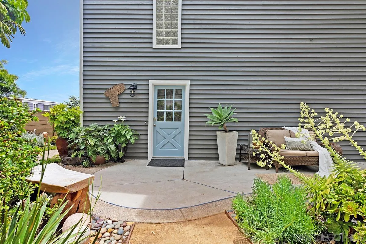 172 Avocado Street Encinitas, CA 92024 - Photo 14 of 19 a backyard of a house with outdoor seating