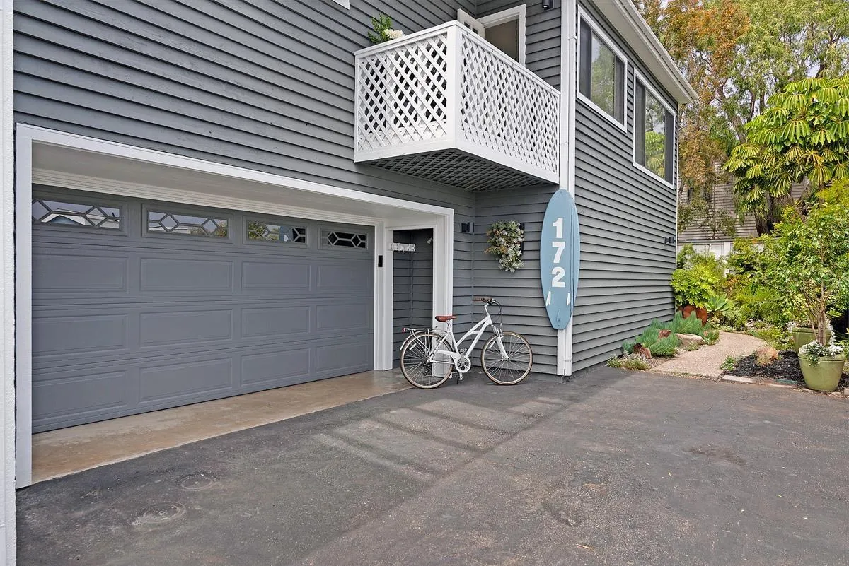 172 Avocado Street Encinitas, CA 92024 - Photo 16 of 19 a view of a house with large space and a car parked beside it