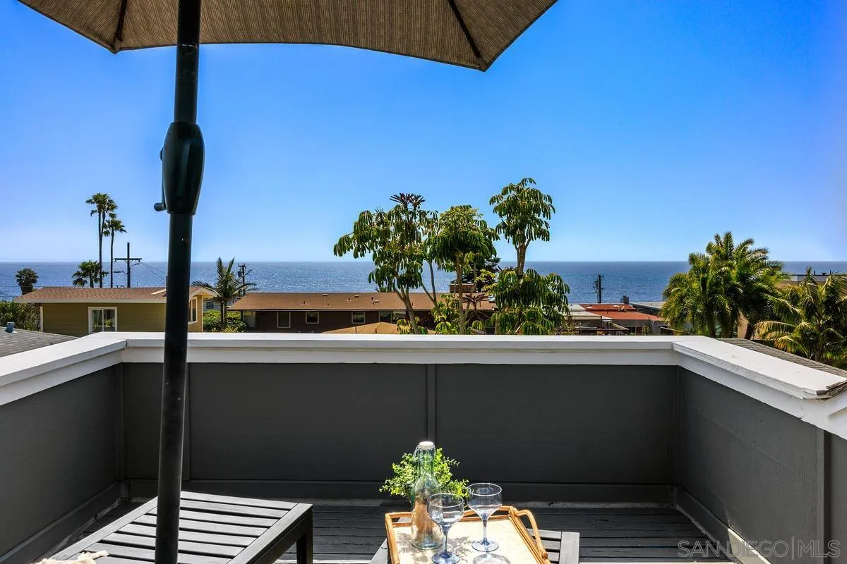 172 Avocado Street Encinitas, CA 92024 - Photo 3 of 19 a vase of flowers sitting on a table