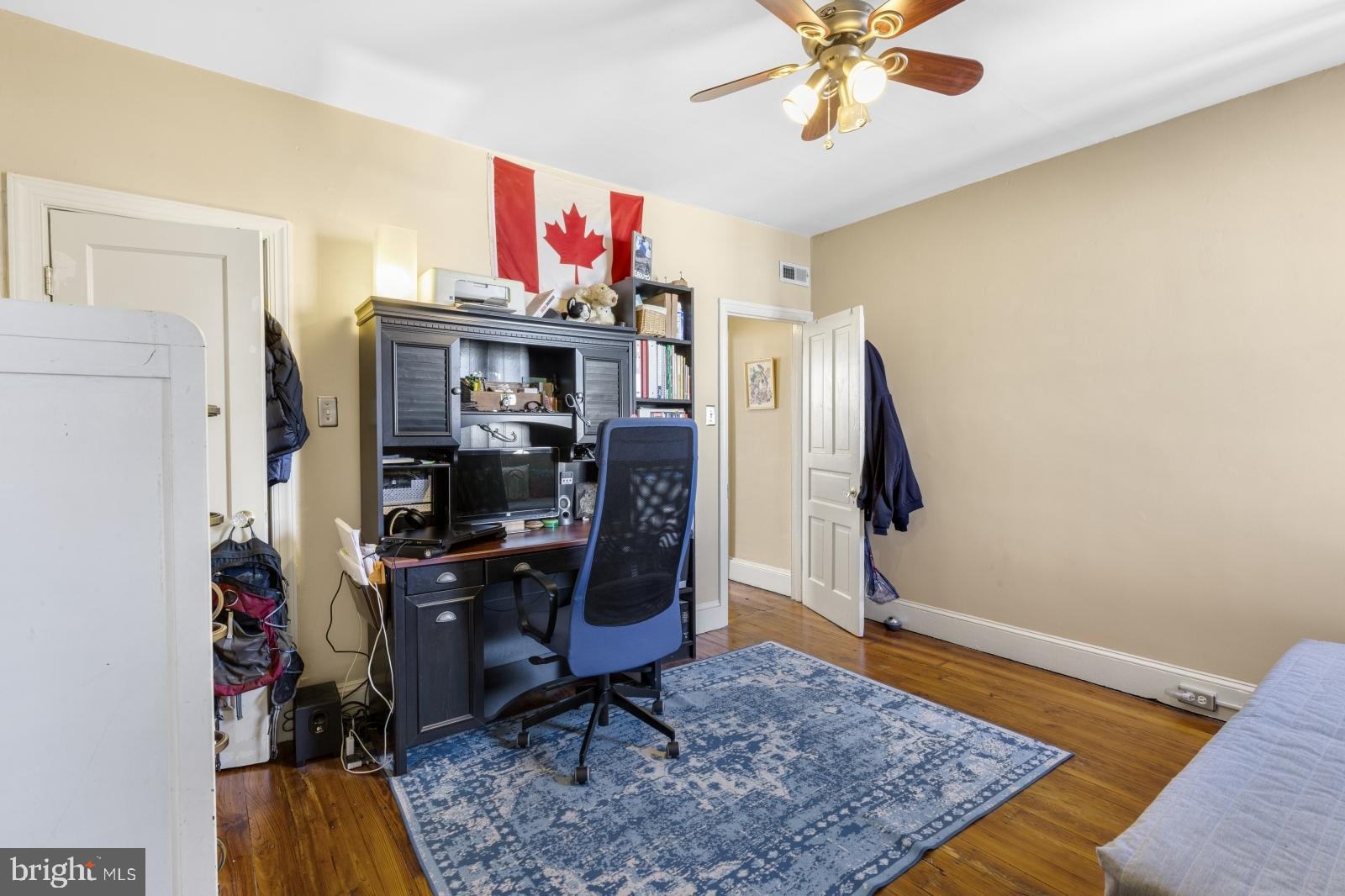 2228 Taggert Street Philadelphia, PA 19125 - Photo 16 of 23 a view of a workspace with furniture and a rug