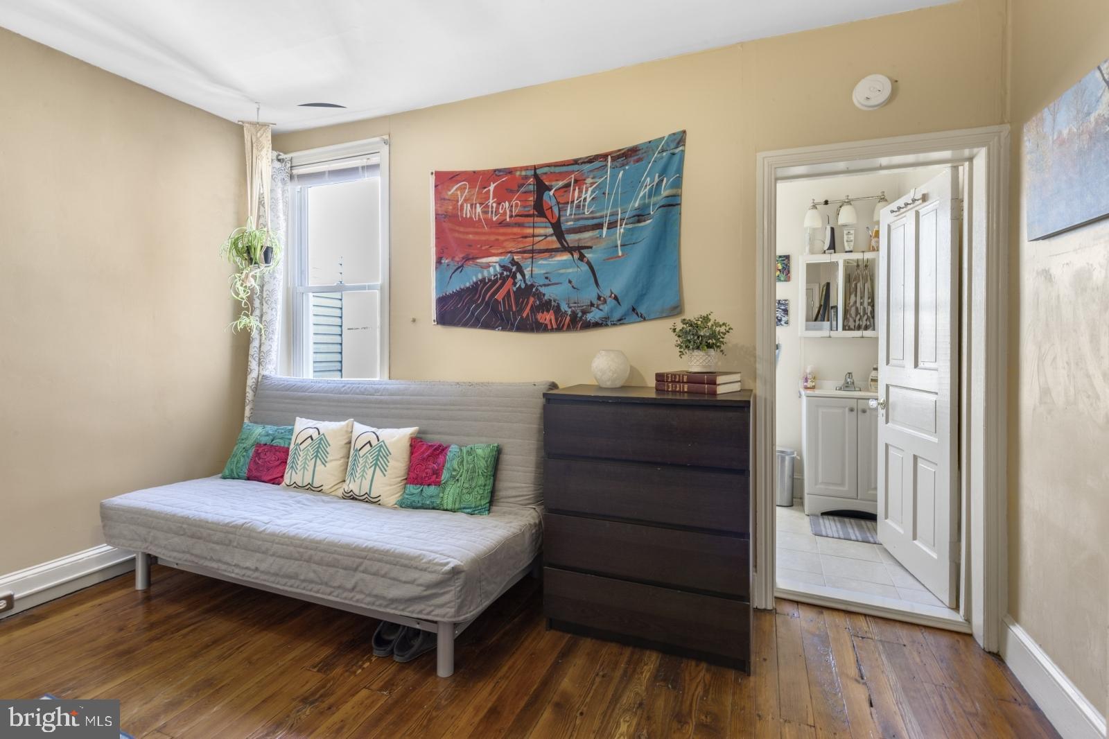 2228 Taggert Street Philadelphia, PA 19125 - Photo 17 of 23 a bedroom with a bed and a painting on the wall
