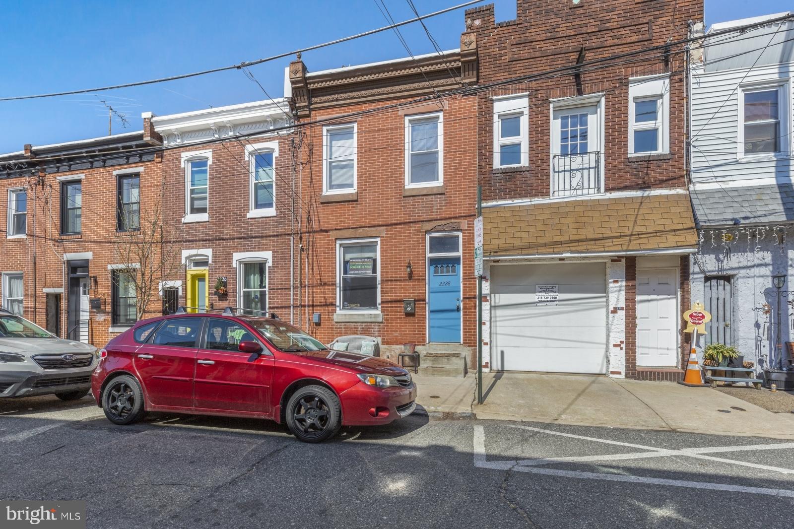 2228 Taggert Street Philadelphia, PA 19125 - Photo 23 of 23 a car parked in front of a house