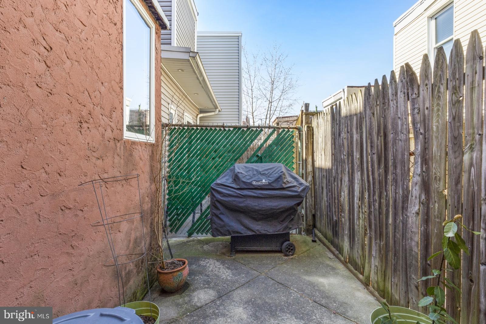 2228 Taggert Street Philadelphia, PA 19125 - Photo 9 of 23 a view of a backyard with wooden fence