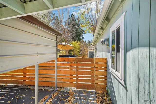 a view of a patio with iron fence