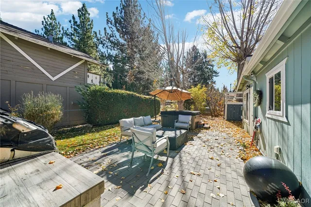 a front view of a house with sitting area
