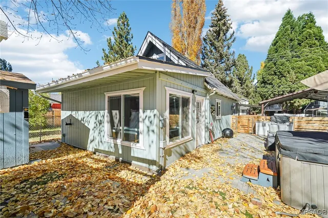 a view of a wooden house with a sink and dishwasher