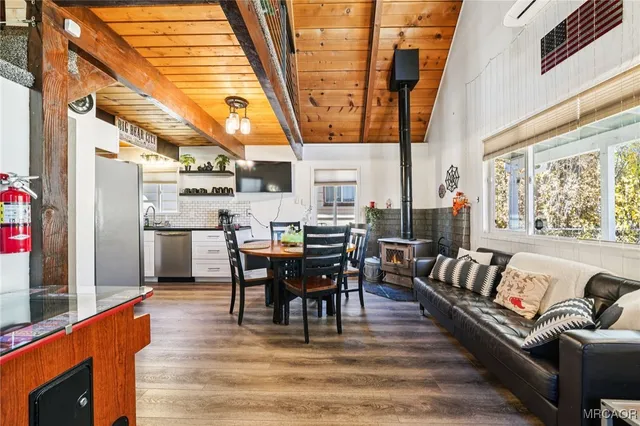 a dining room with furniture and wooden floor