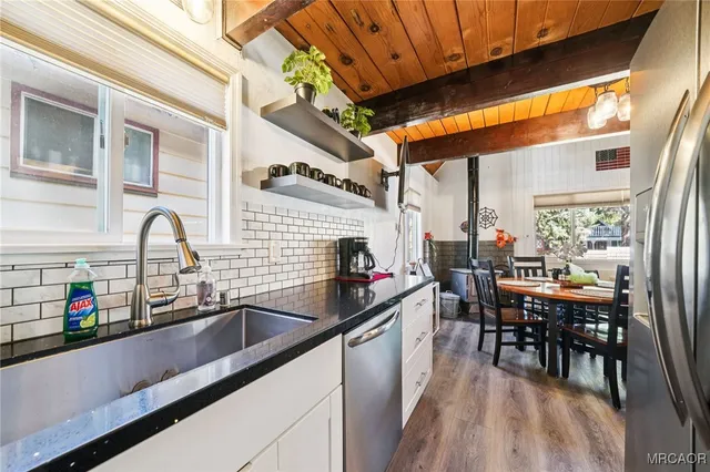 a kitchen with a sink and cabinets