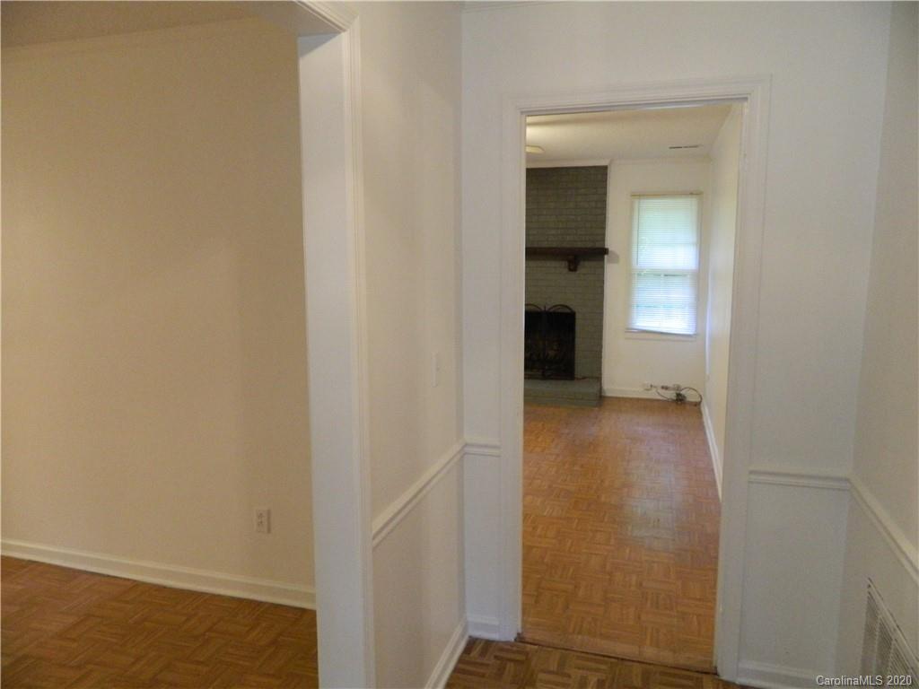 5718 Trotters Ridge Road Charlotte, NC 28227 - Photo 2 of 18 a view of a hallway with wooden floor