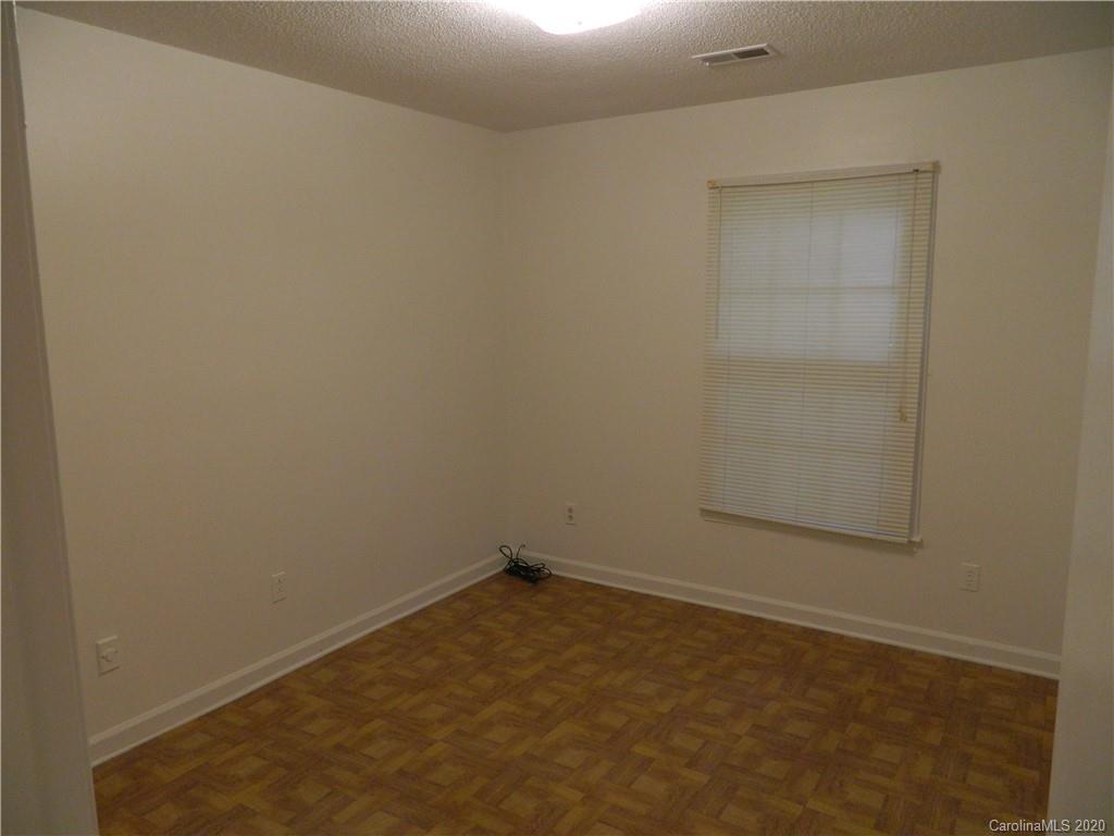 5718 Trotters Ridge Road Charlotte, NC 28227 - Photo 11 of 18 an empty room with a bench