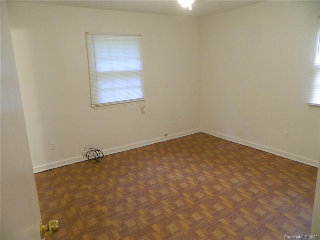 5718 Trotters Ridge Road Charlotte, NC 28227 - Photo 14 of 18 an empty room with a window