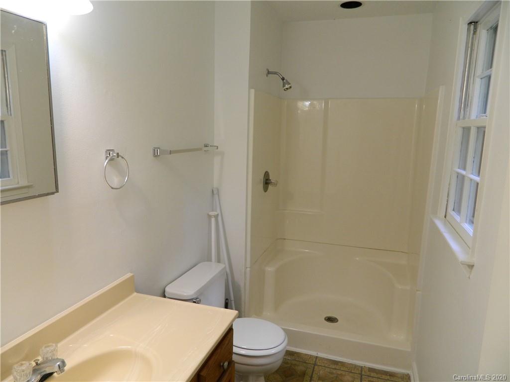 5718 Trotters Ridge Road Charlotte, NC 28227 - Photo 16 of 18 a bathroom with a toilet and a shower