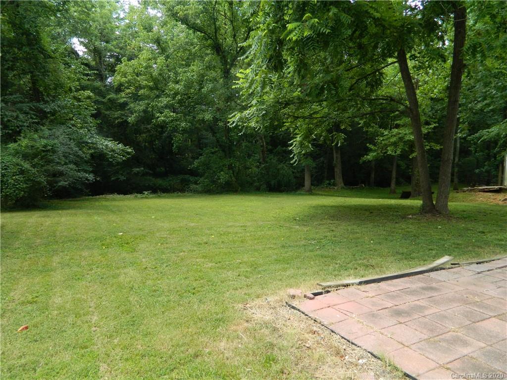 5718 Trotters Ridge Road Charlotte, NC 28227 - Photo 17 of 18 a view of a field with a trees