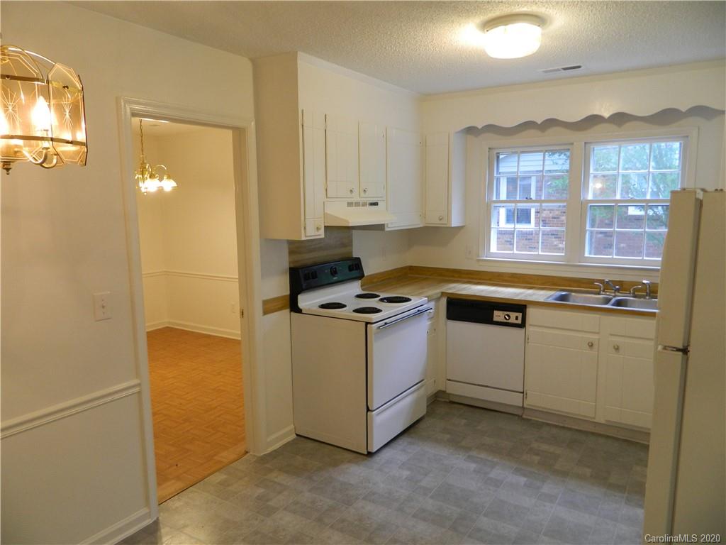 5718 Trotters Ridge Road Charlotte, NC 28227 - Photo 7 of 18 a kitchen with a refrigerator and a sink