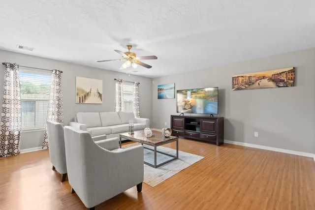 a living room with furniture and a window