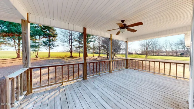 a view of a porch with wooden floor