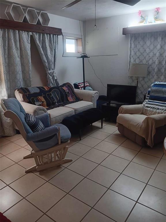 4245 Edgewater Drive Orlando, FL 32804 - Photo 11 of 44 a living room with furniture and a fireplace