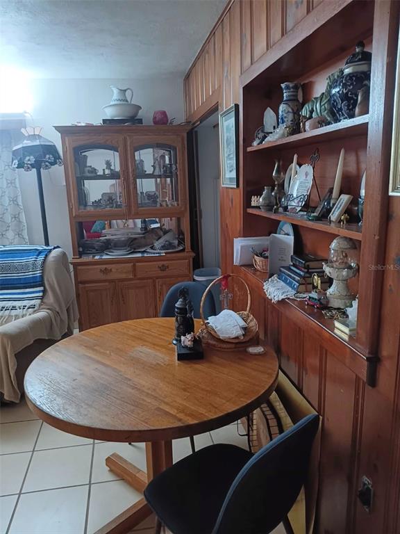 4245 Edgewater Drive Orlando, FL 32804 - Photo 12 of 44 a view of a dining room with furniture