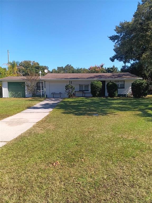 4245 Edgewater Drive Orlando, FL 32804 - Photo 2 of 44 a view of a house with a big yard and potted plants