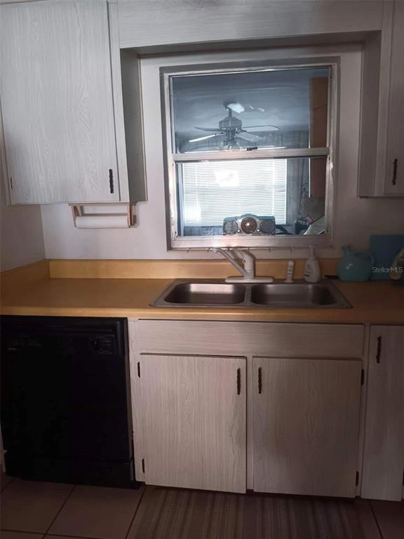 4245 Edgewater Drive Orlando, FL 32804 - Photo 22 of 44 a bathroom with a sink and a mirror