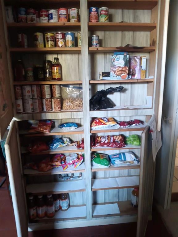 4245 Edgewater Drive Orlando, FL 32804 - Photo 23 of 44 a store room with lots of different kinds of food