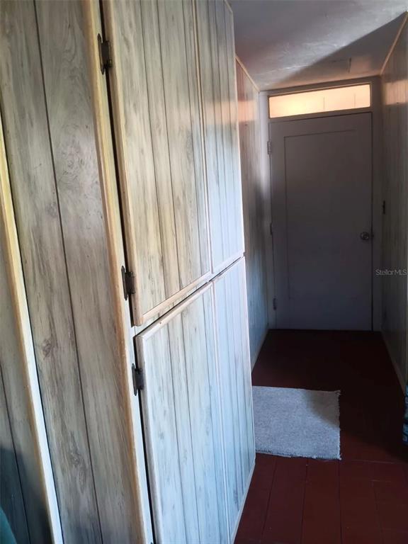 4245 Edgewater Drive Orlando, FL 32804 - Photo 26 of 44 a walk in closet with wooden floor