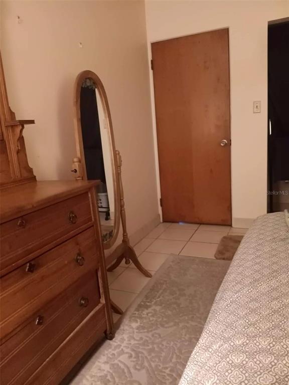 4245 Edgewater Drive Orlando, FL 32804 - Photo 27 of 44 a view of front door with furniture and a mirror