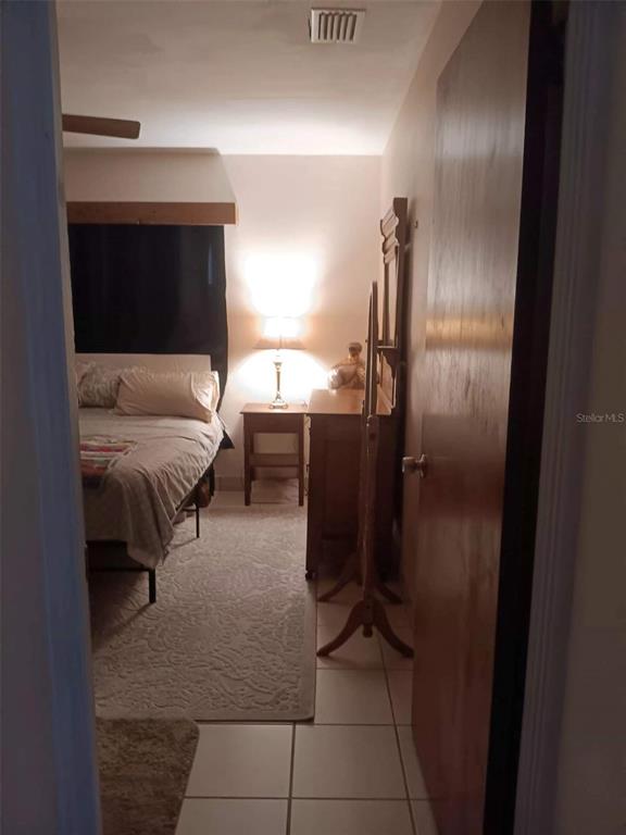 4245 Edgewater Drive Orlando, FL 32804 - Photo 28 of 44 a en suite bathroom with a sink and a mirror