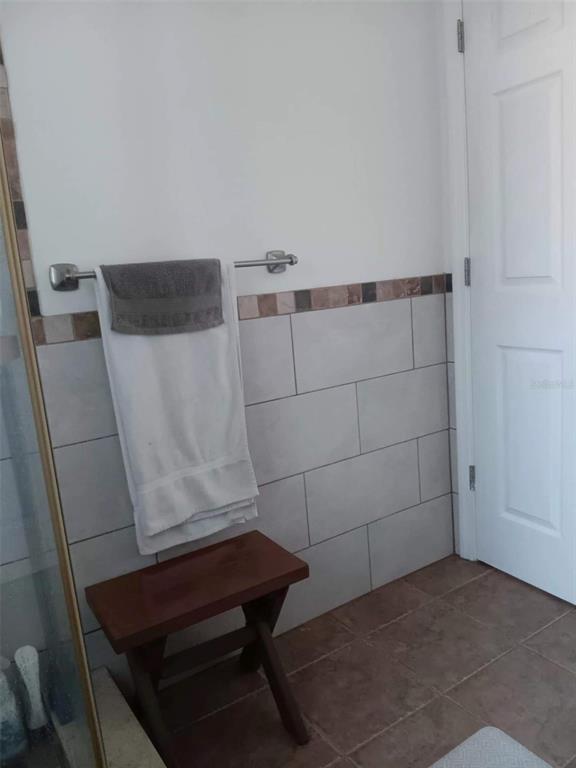 4245 Edgewater Drive Orlando, FL 32804 - Photo 33 of 44 a bathroom with a sink and a mirror