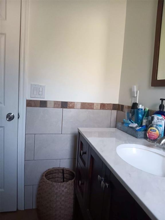 4245 Edgewater Drive Orlando, FL 32804 - Photo 37 of 44 a bathroom with a sink and a mirror