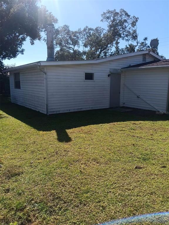 4245 Edgewater Drive Orlando, FL 32804 - Photo 42 of 44 a view of a backyard of the house