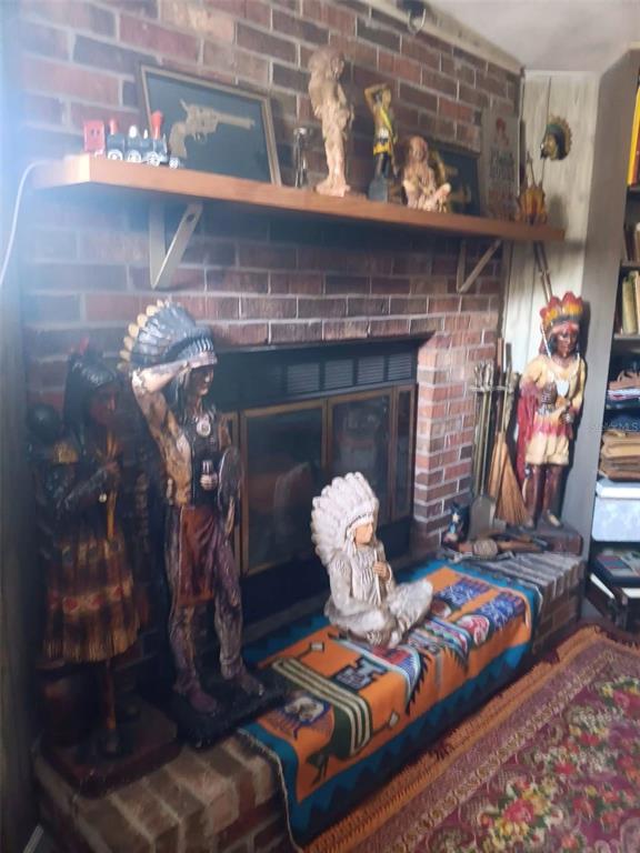 4245 Edgewater Drive Orlando, FL 32804 - Photo 7 of 44 a living room with furniture and a fireplace