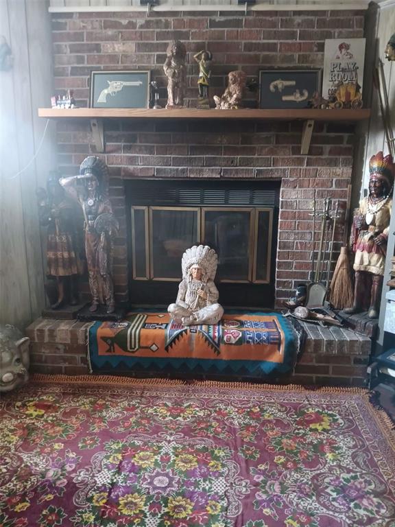 4245 Edgewater Drive Orlando, FL 32804 - Photo 8 of 44 a living room with furniture and a fireplace