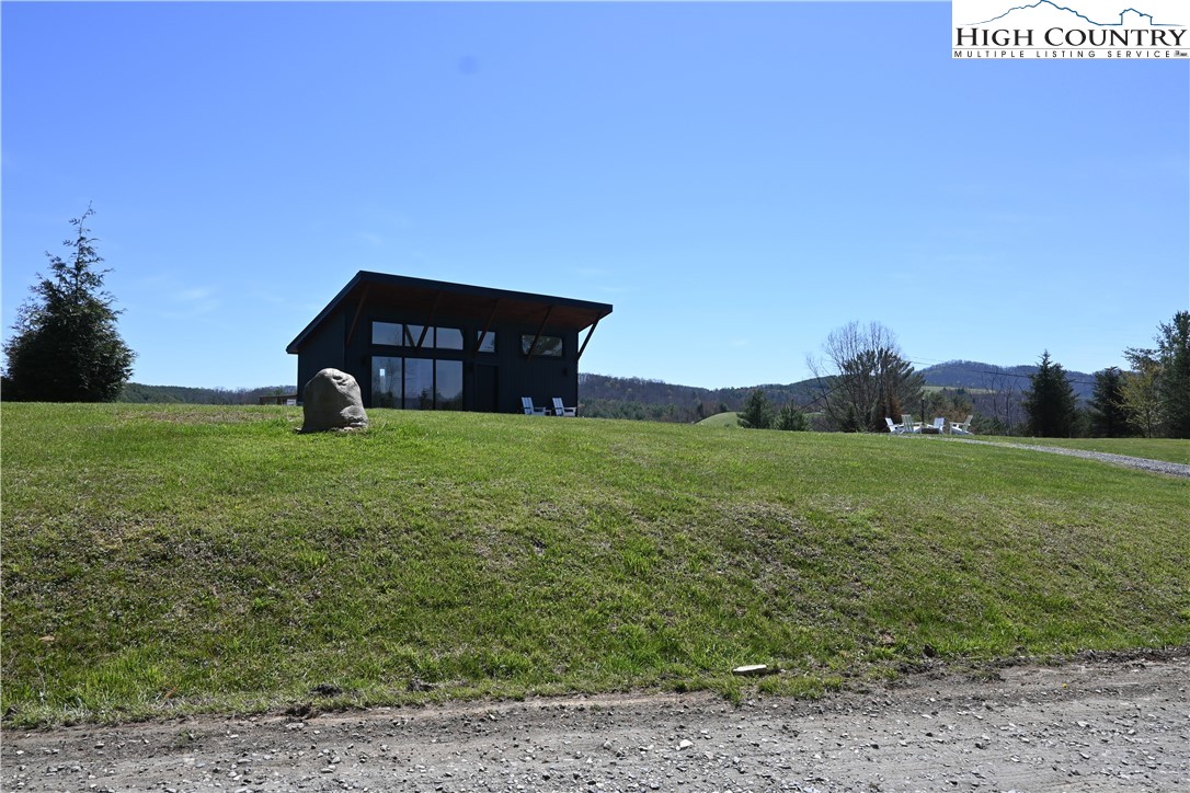 15 A River Bend Hills Road Crumpler, NC 28617 - Photo 8 of 9 a view of a field with an trees