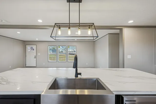 a kitchen with refrigerator and stove
