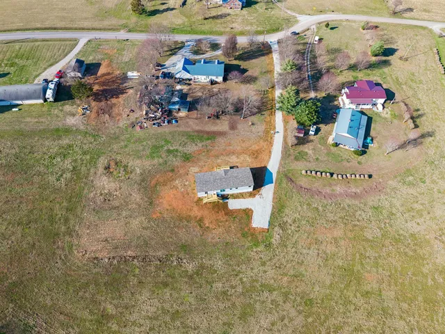 swimming pool with a view of residential houses with outdoor space